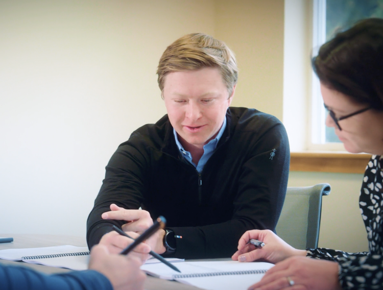 HUB Team Haugen advisor reviewing a client program